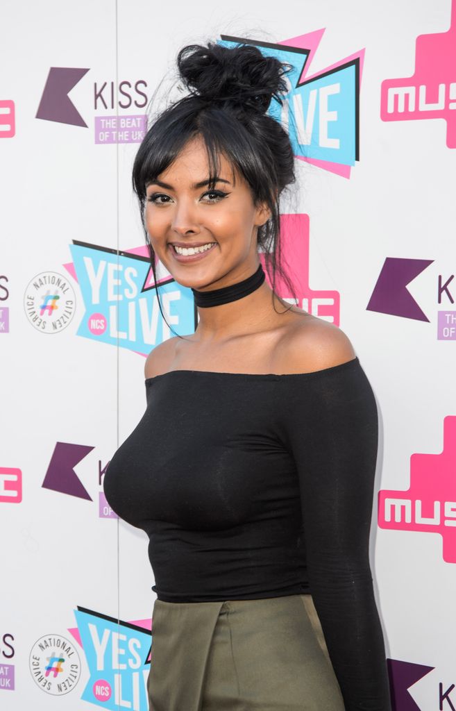 Maya Jama in 2016 in an off the shoulder black top