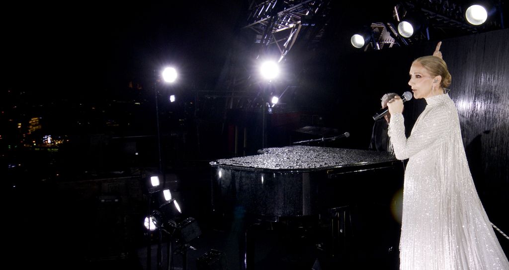 Celine Dion performing on the Eiffel Tower during the opening ceremony