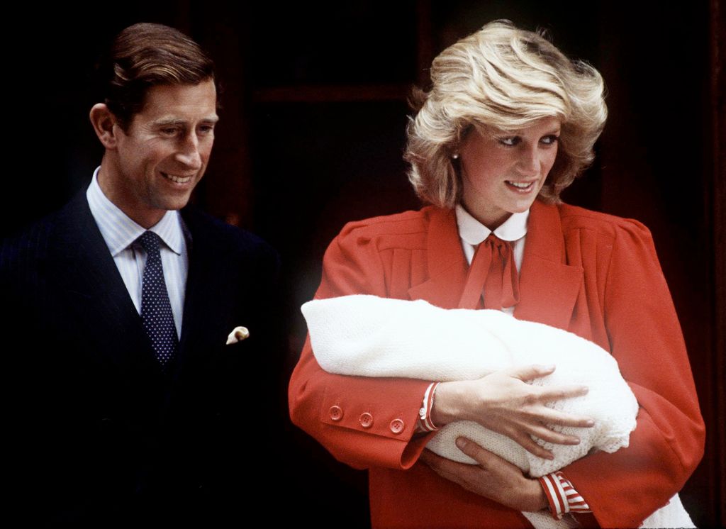 Diana holds newborn Prince Harry