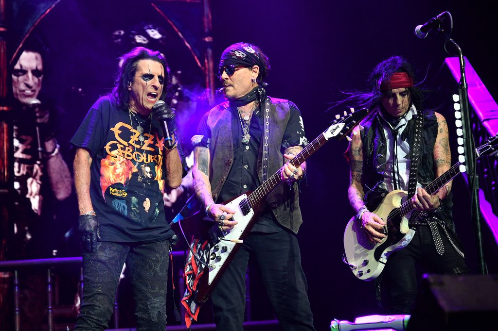 Alice Cooper, Johnny Depp and Tommy Henriksen perform a tribute to Ozzy Osbourne during a concert at The O2 Arena 