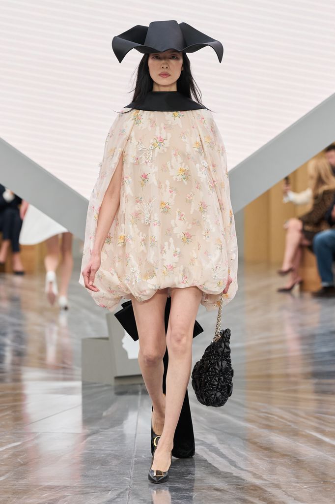 Dior SS26 - a model walks down the runway wearing Lila Moss' ensemble