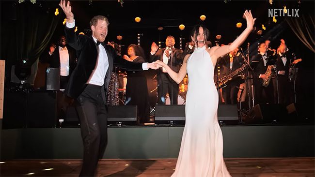 Prince Harry and Meghan Markle dancing in wedding outfits