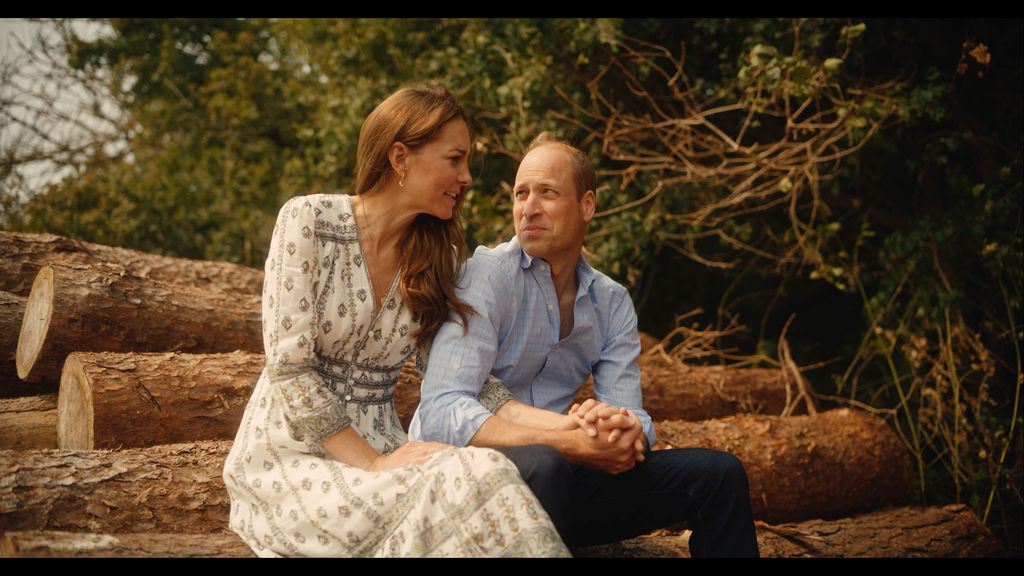 Kate Middleton and Prince William look of love while sitting on log stack