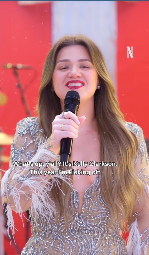 Kelly in a sheer, embellished jumpsuit