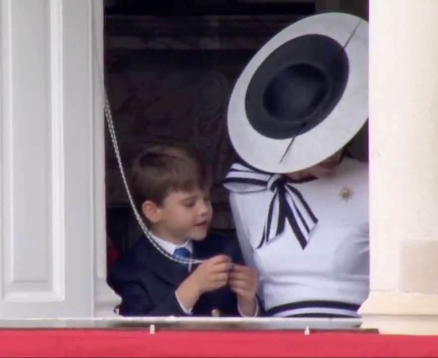 Prince Louis plays with curtain cord