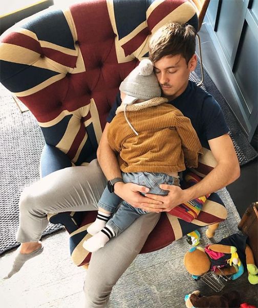 Tom Daley with son sleeping on him
