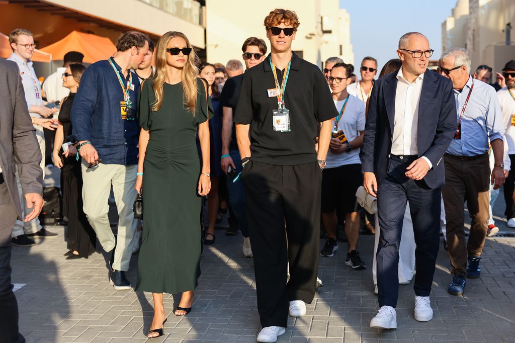 Jannik Sinner and his girlfriend Laila Hasanovic walking in the paddock with Stefano Domenicali ahead Formula 1 Abu Dhabi Grand Prix at Yas Marina Circuit on December 7th, 2025 in Abu Dhabi, United Arab Emirates.  (Photo by Beata Zawrzel/NurPhoto via Getty Images)