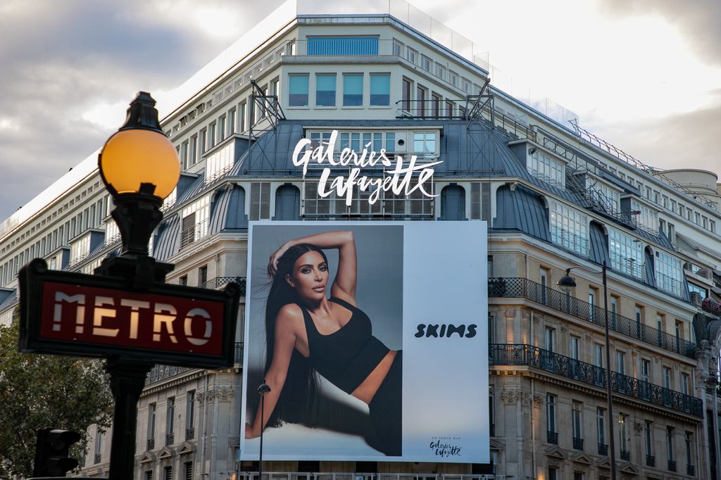 A SKIMS giant poster with Kim Kardashian West is displayed at the 'Galeries Lafayette' department store on October 04, 2021 in Paris, France