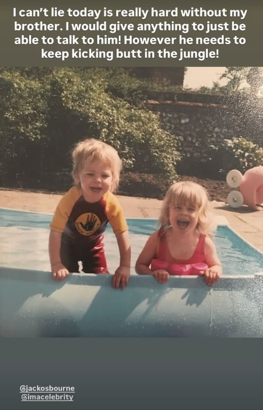 A photo of two young children in a pool