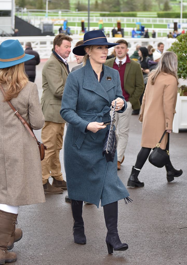 Zara Tindall in blue hat and coat
