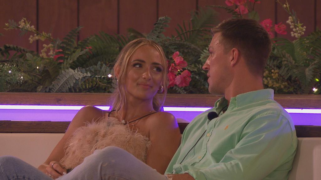 Abi and Mitch chat by the firepit in Love Island
