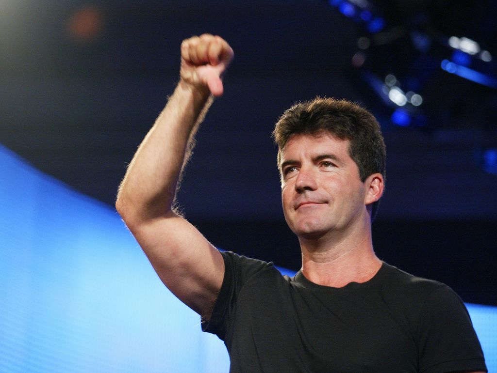 American Idol judge Simon Cowell demonstrates his style for the press at the FOX 2002 SummerTCA Tour at the Huntington Ritz Carlton Hotel in Pasadena, CA on Monday, July 22, 2002