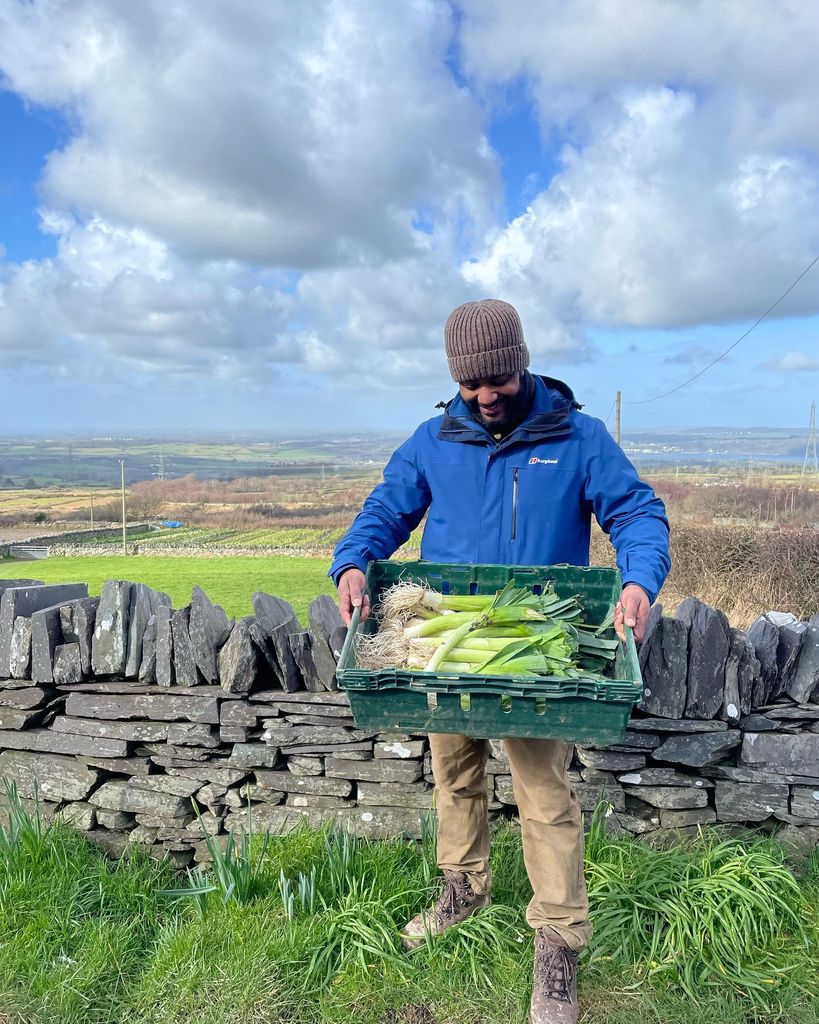 JB gill holding crate of leeks 