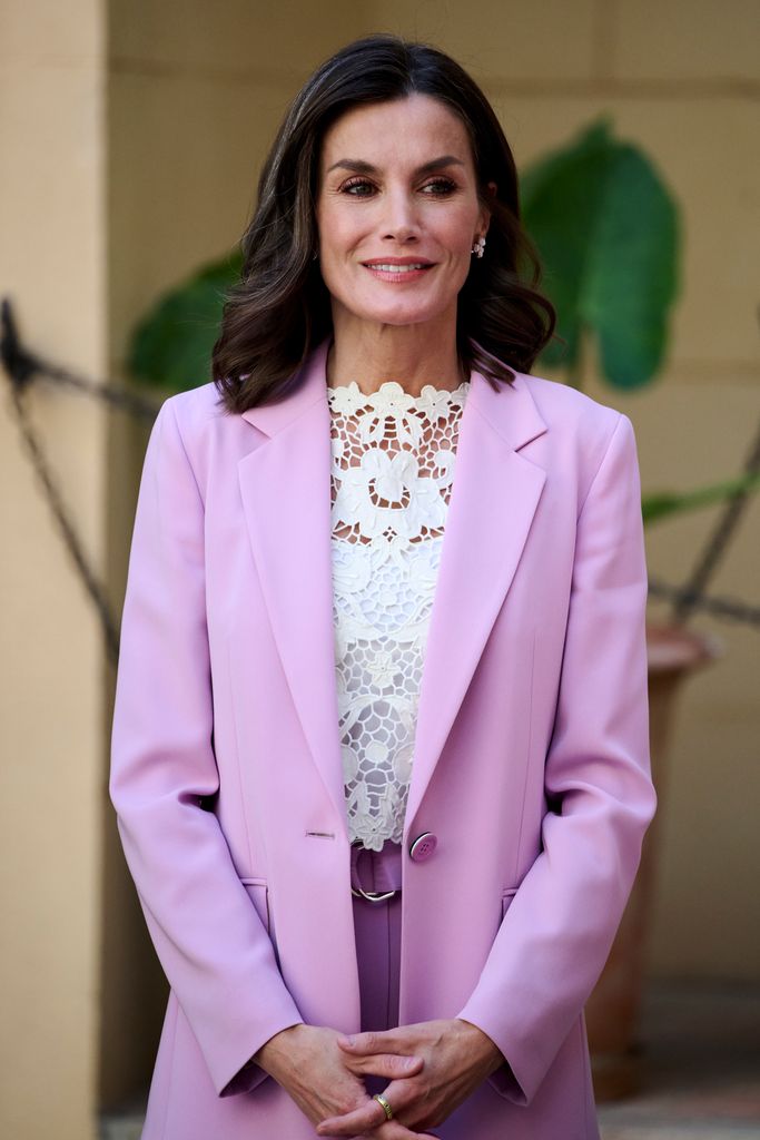 Queen Letizia in lilac suit smiling