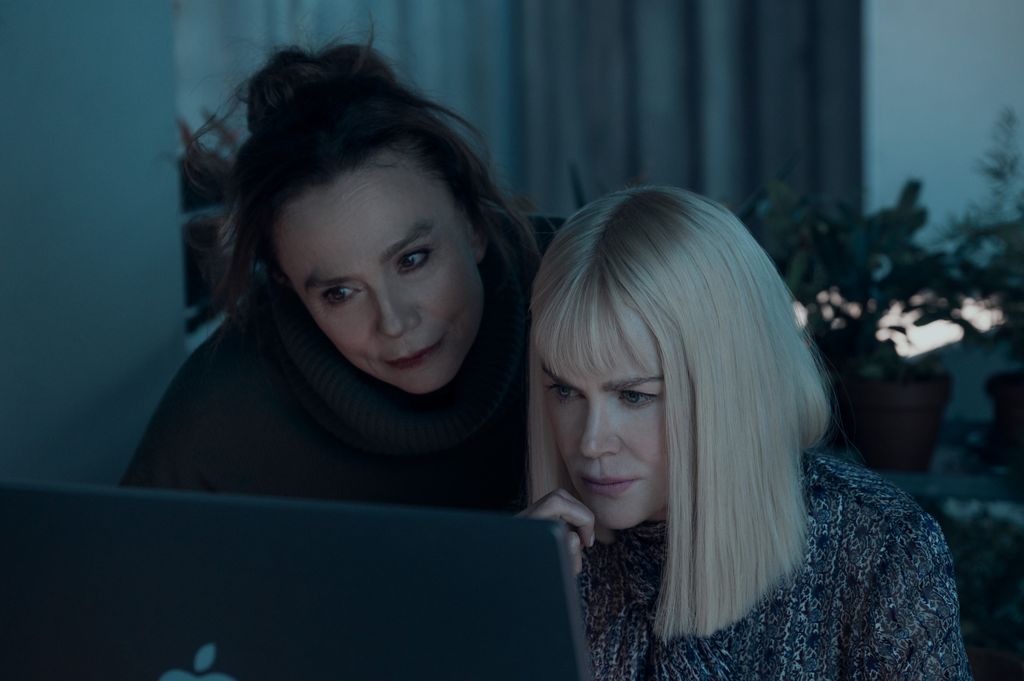 two women looking at computer