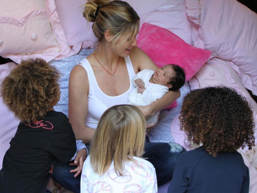 Heidi Klum with children holding youngest daughter baby Lou