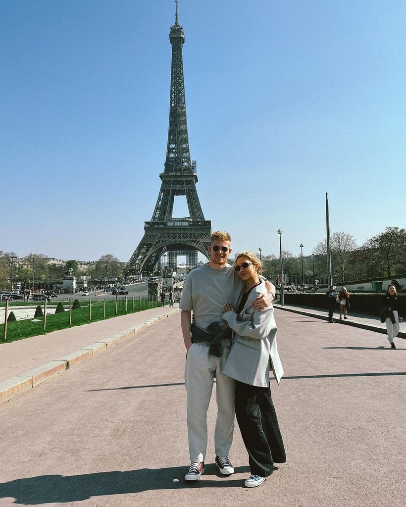 Michele and Kevin next to the Eiffel Tower 