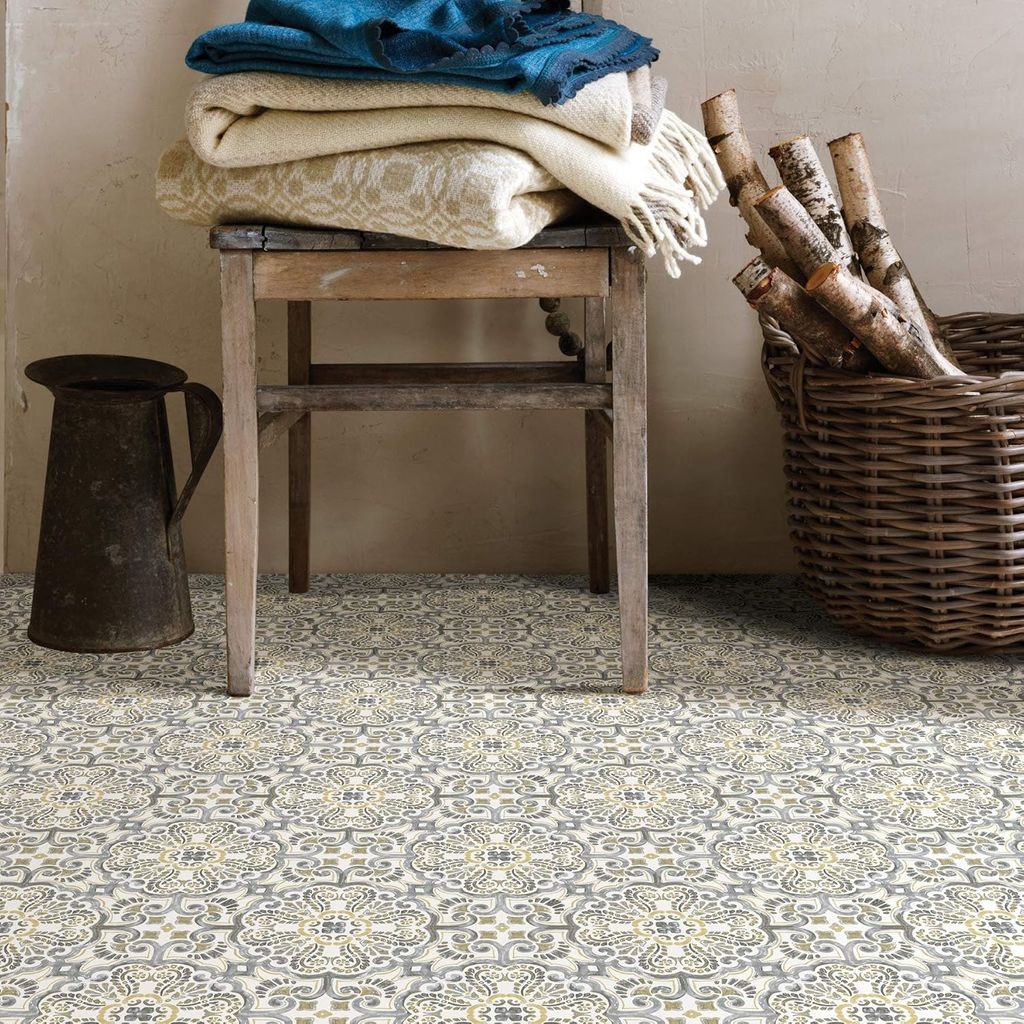 Moroccan tiles, a wicker basket and a chair with folded towels and blankets above