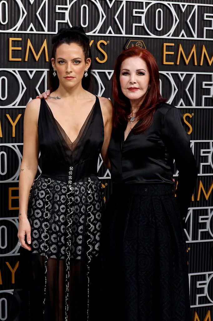 photo of riley keough and priscilla presley wearing black outfits