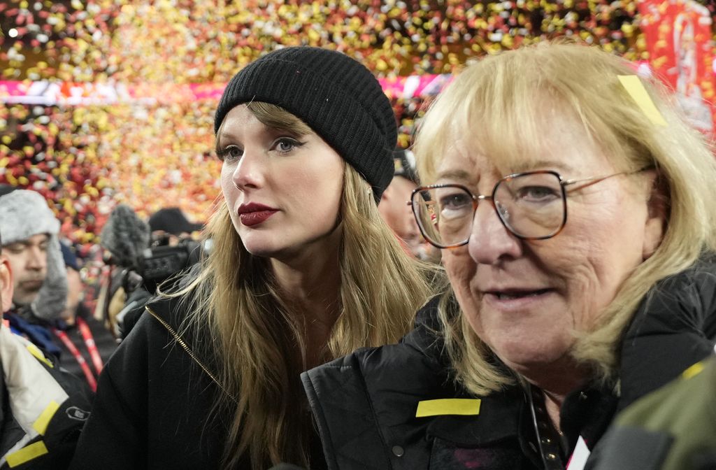 Donna Kelce, mother of Kansas City Chiefs tight end Travis Kelce, stands with Taylor Swift