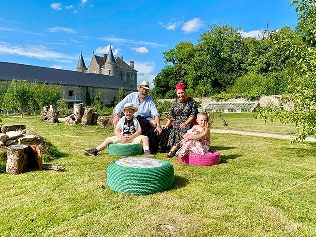 The Strawbridge family sit in garden at Chateau