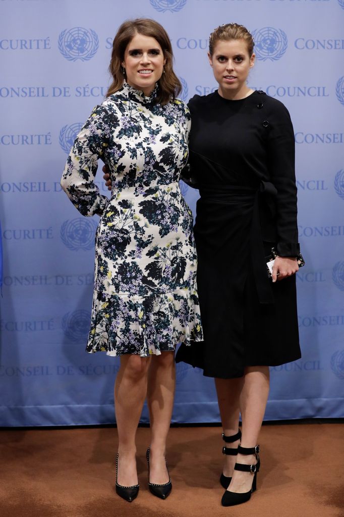 Princess Beatrice in a black dress with her sister Princess Eugenie