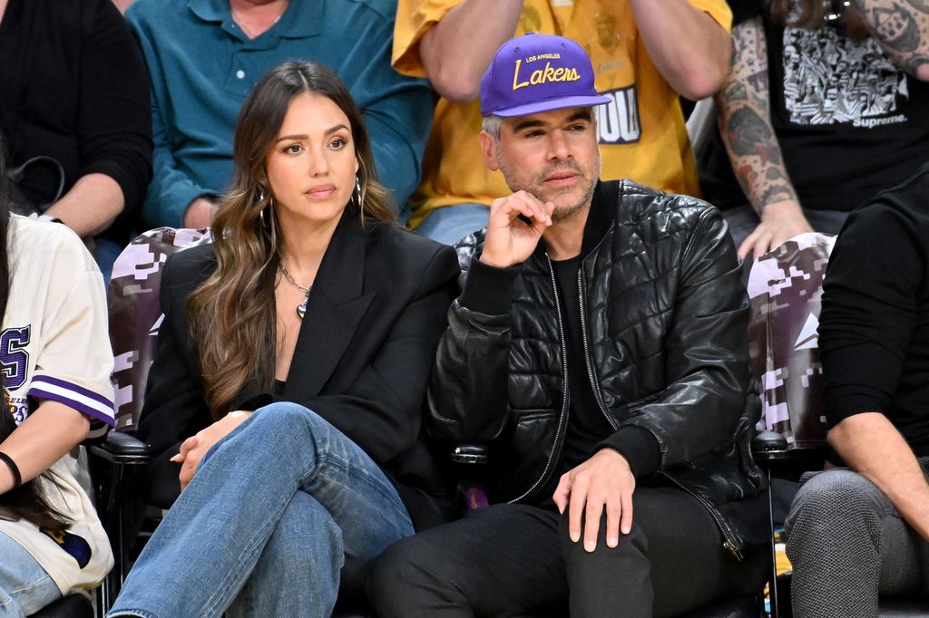 Jessica Alba and Cash Warren attend a basketball game between the Los Angeles Lakers and the Toronto Raptors 