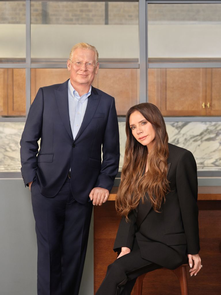 Victoria Beckham sat down with Augustinus Bader stood next to her