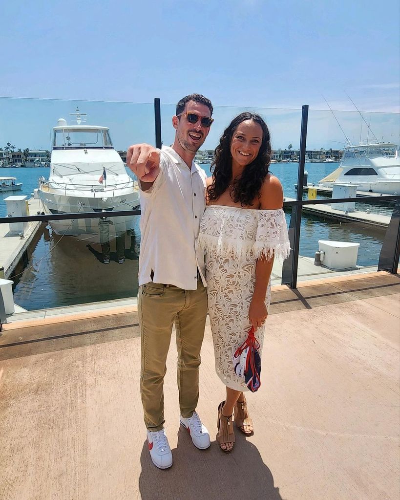 Maggie Steffens and her husband Bobby Conner pose for a photo near a marina, shared on Instagram