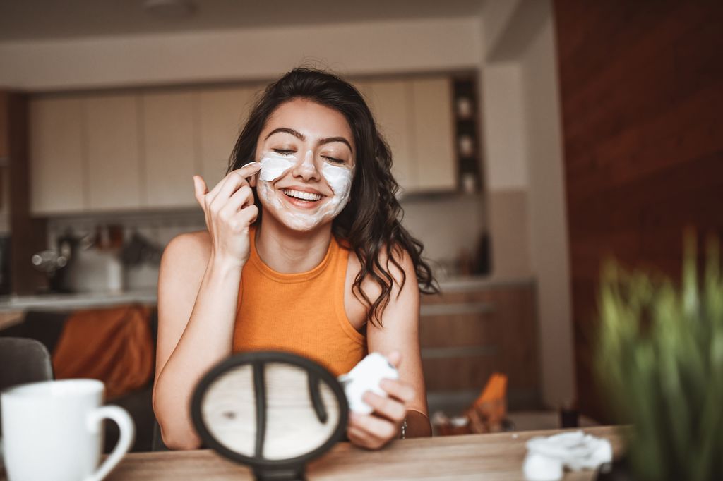 Smiling Female In Love With New Skin Care Products