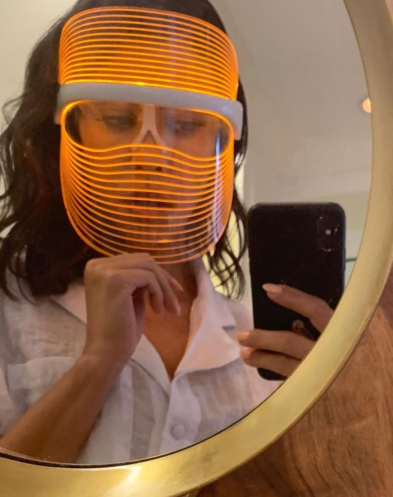 Kourtney Kardashian wearing an LED face mask