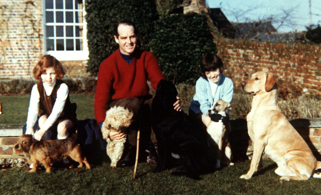 A young Sarah and Jane Ferguson with Ronald Ferguson and four dogs