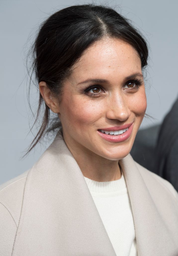 Meghan Markle smiles during her visit to the Eikon Centre with Prince Harry to attend an event to mark the second year of the youth-led peace-building initiative 'Amazing the Space' on March 23, 2018 in Lisburn, Northern Ireland.  