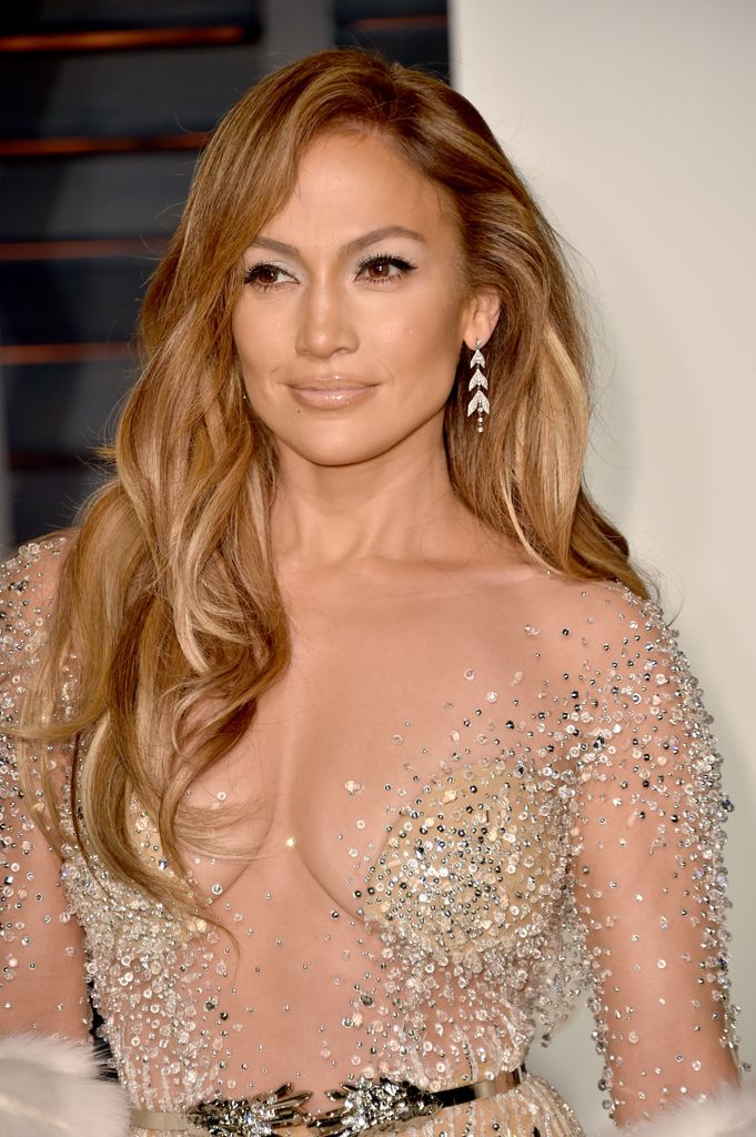 JLo's on red carpet in sheer sequin dress