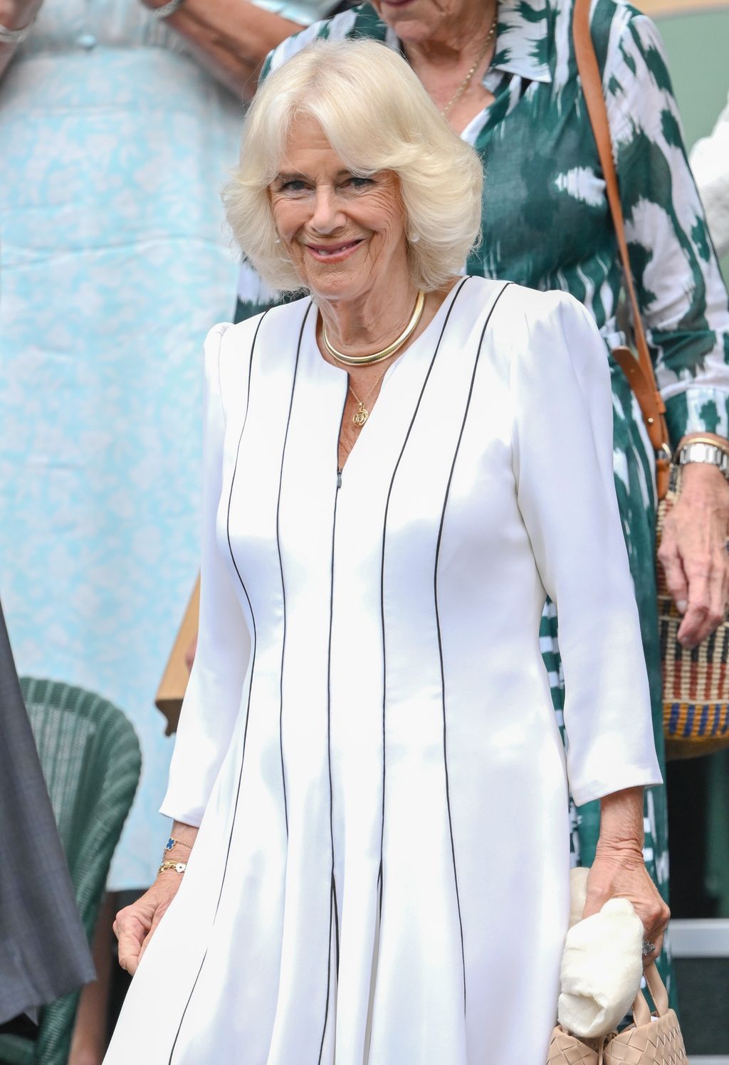 Queen Camilla at Wimbledon in a white dress