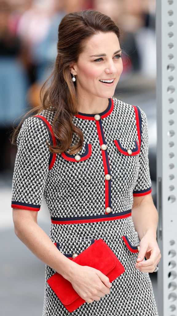 Kate with hair in beehive half updo wearing houndstooth dress