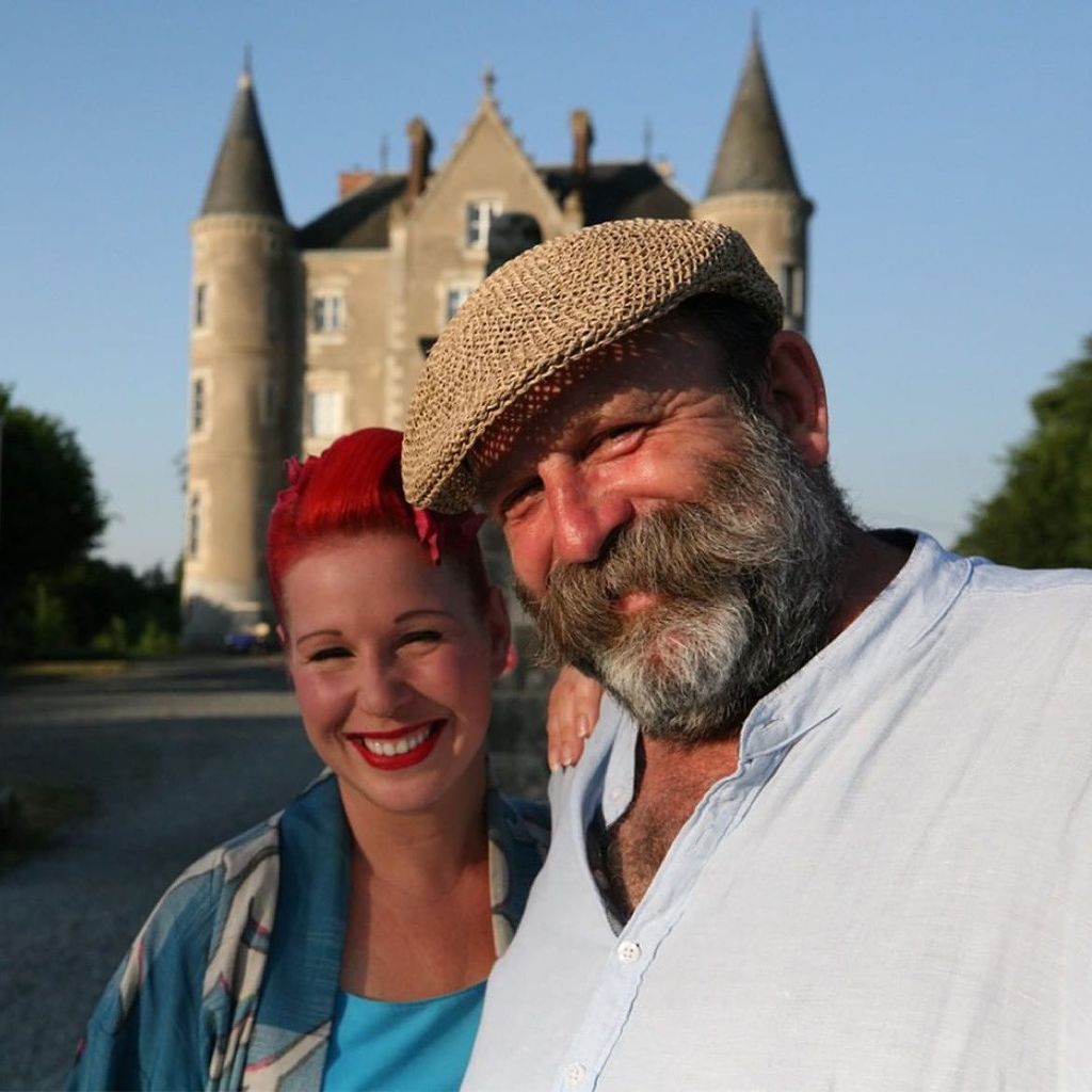 Angel and Dick Strawbridge posing in front of Chateau de la Motte Husson