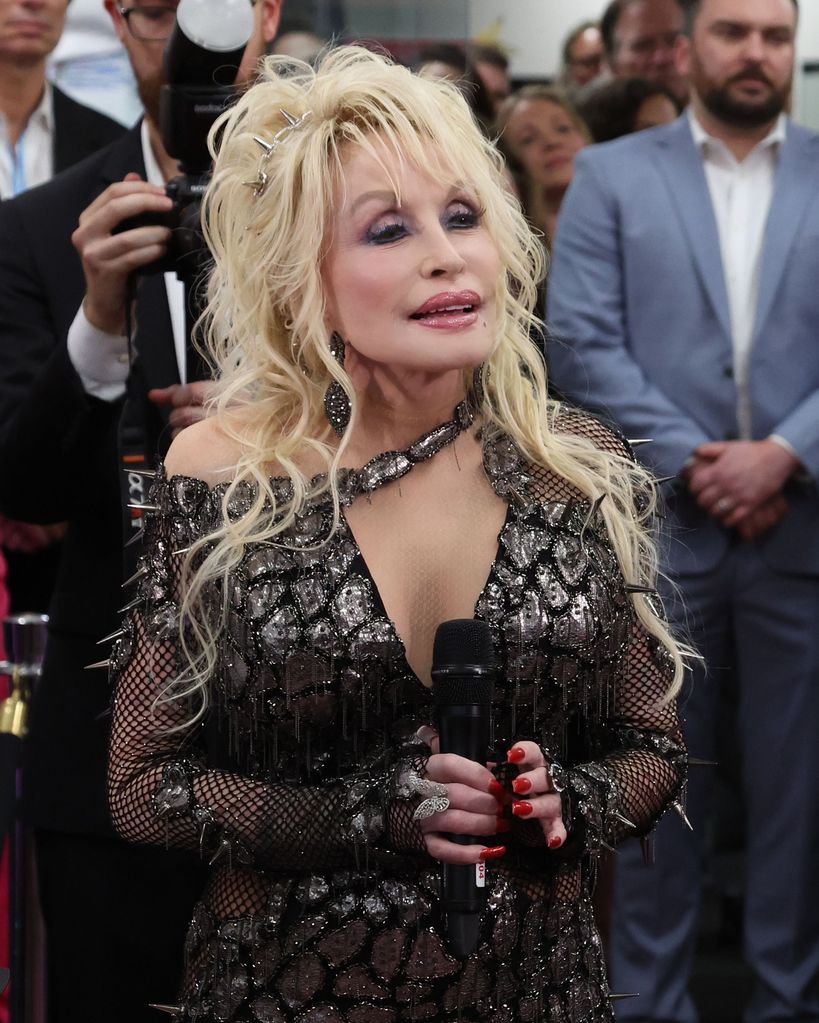Dolly Parton in a snake print dress