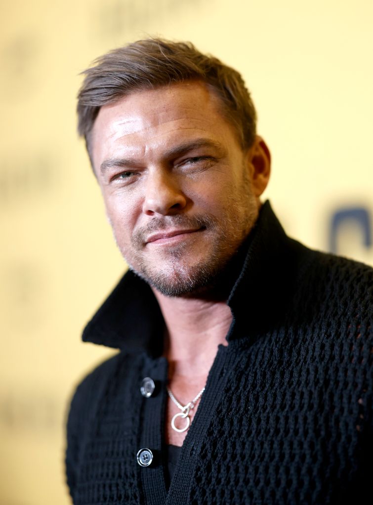 Alan Ritchson handsome black sweater 