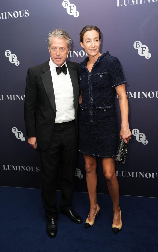 couple posing on red carpet