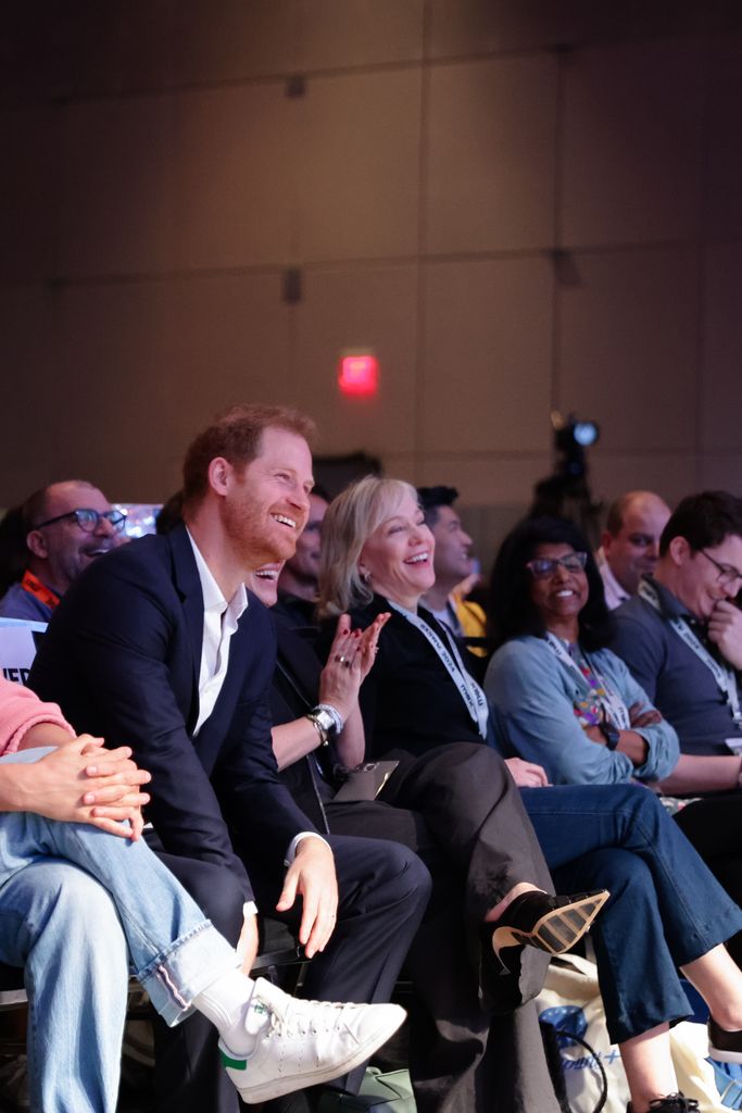 Prince Harry in audience smiling