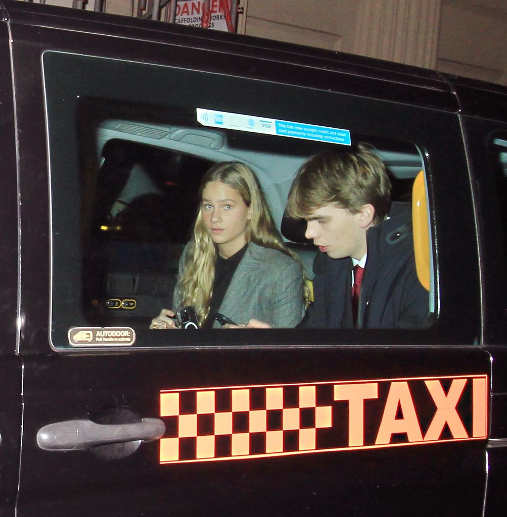 brother and sister sat in back of taxi 