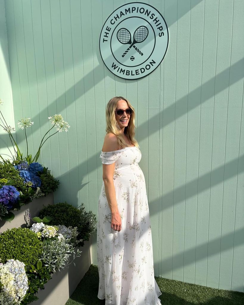 pregnant woman in white maxi dress