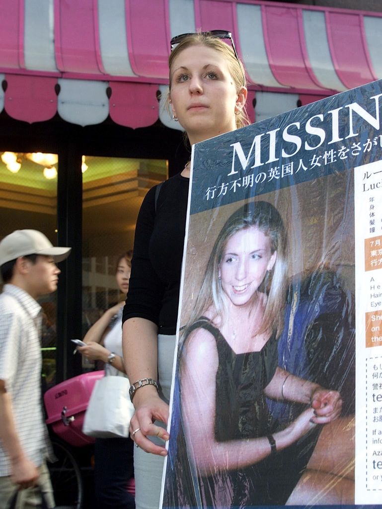 Sophie Blackman, younger sister of missing British bar hostess Lucie, holds a large poster to appeal for new information at the Roppongi district in Tokyo, 01 September 2000.