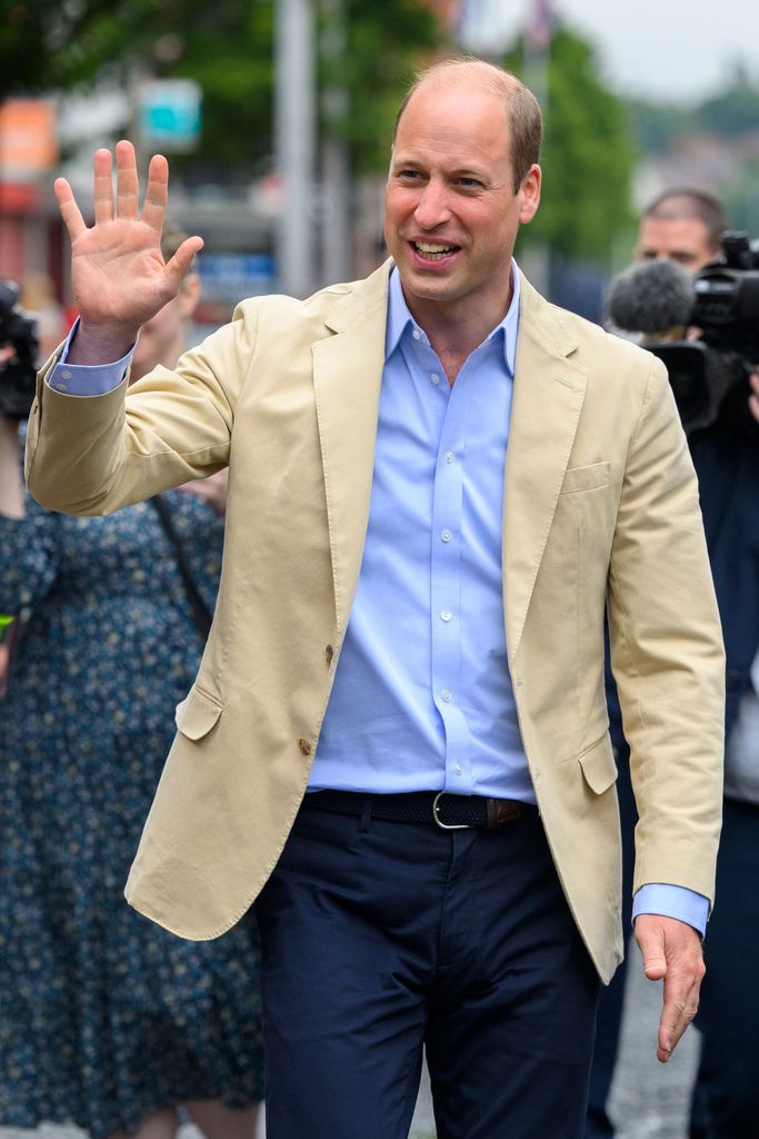 Prince William waves as he visits the East Belfast Mission