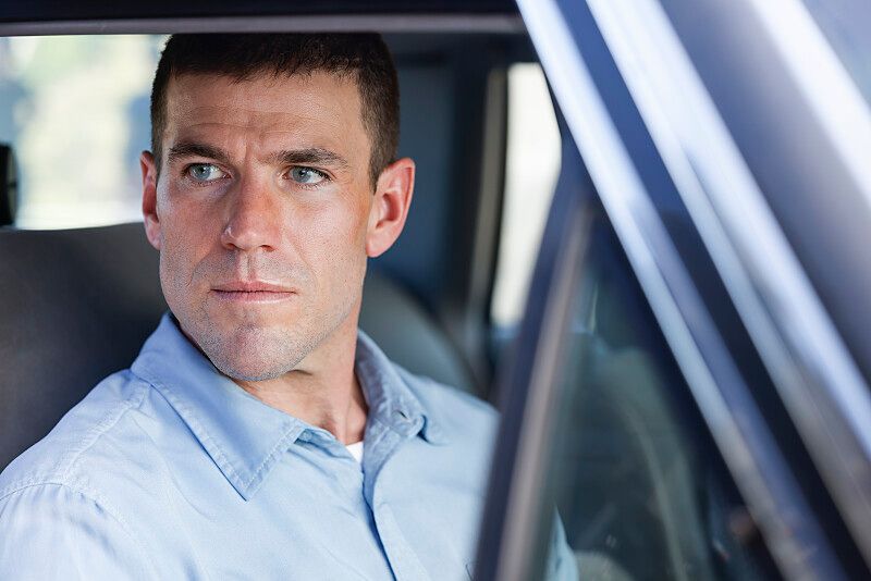 close-up man sitting in car
