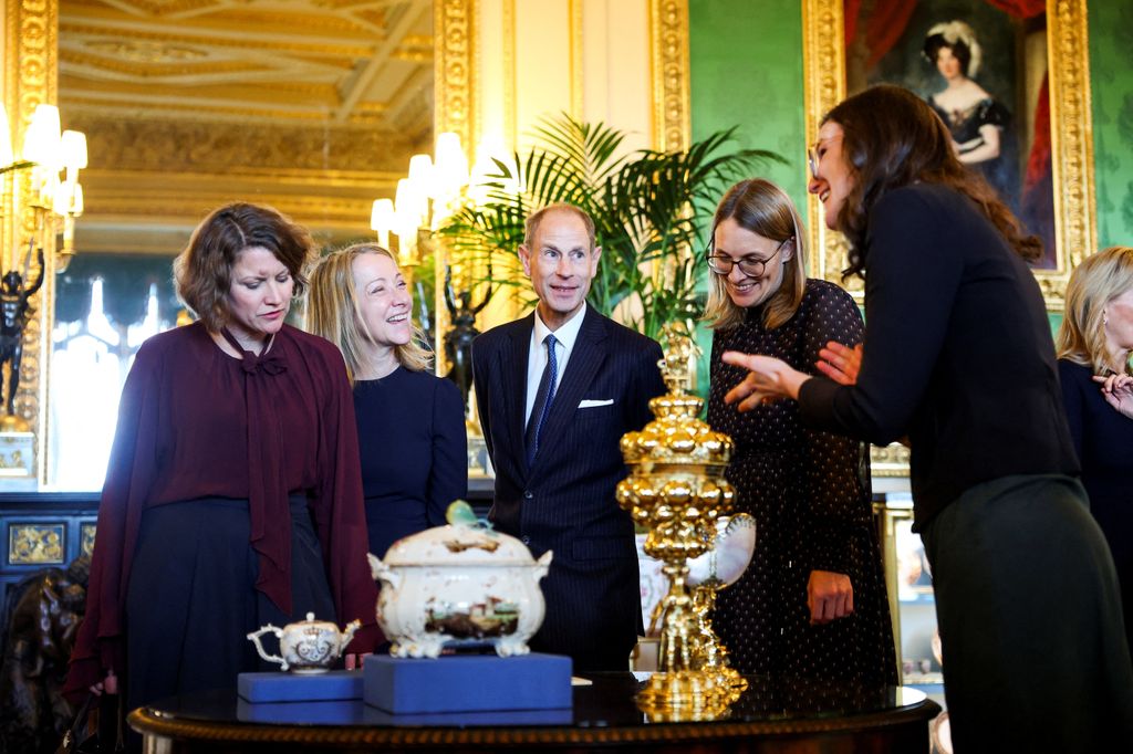 Prince Edward, Duke of Edinburgh views items on display relating to Germany during a visit to the Royal Collection exhibition in the Green Drawing Room 