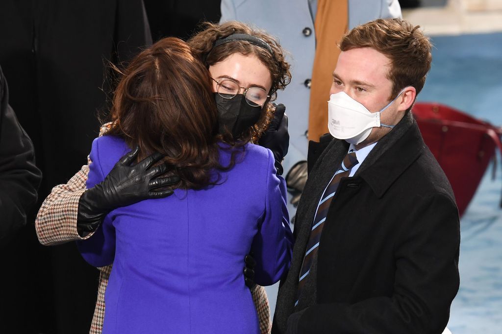 Kamala Harris greets stepchildren Cole Emhoff and Ella Emhoff as she arrives for the inauguration of Joe Biden as the 46th US President on January 20, 2021