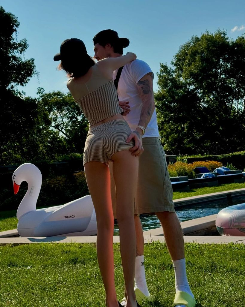 couple hugging by pool