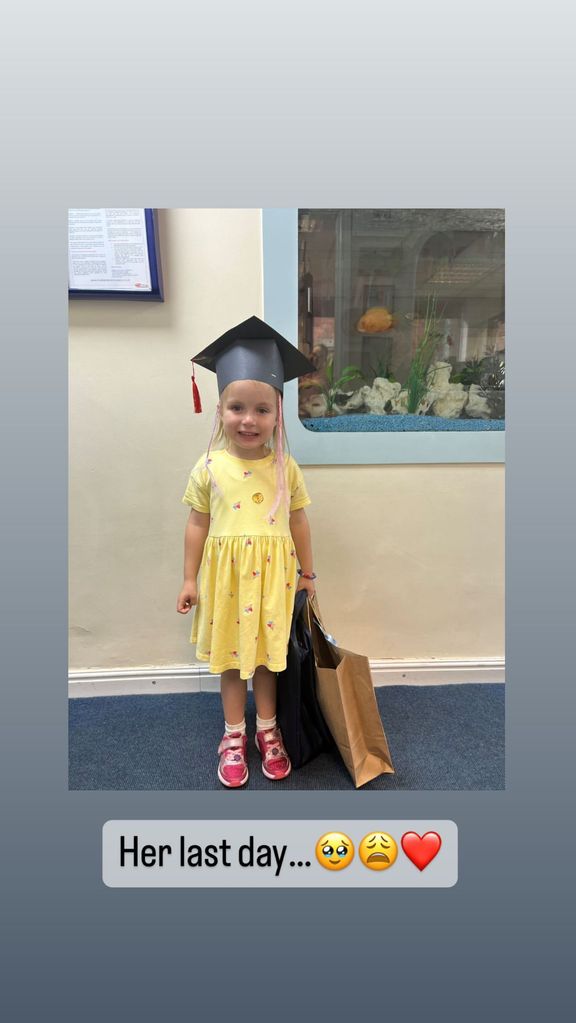 Mia posing with her graduating hat on the last day of nursery
